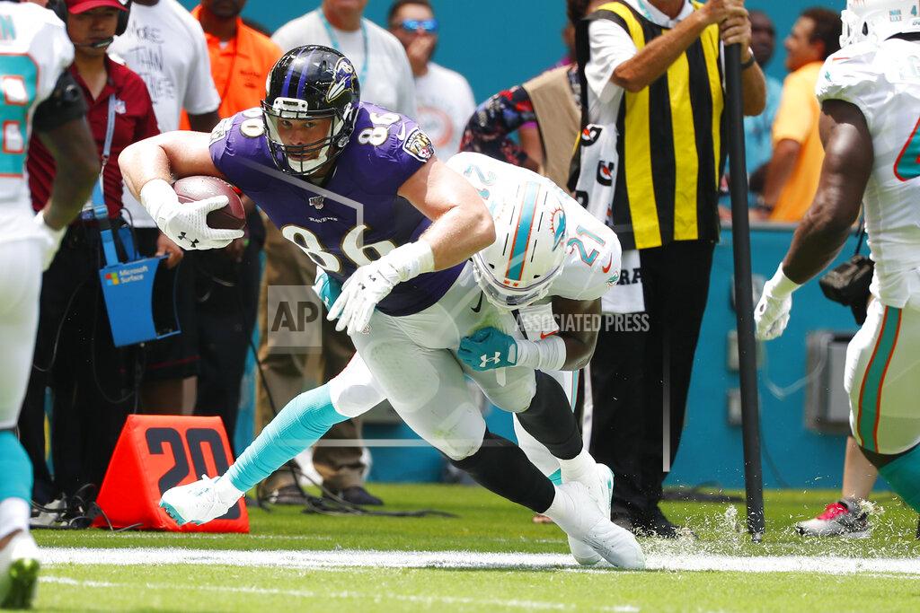 Wilfredo Lee Miami Dolphins cornerback Eric Rowe (21) tackles Baltimore Ravens tight end Nick Boyle (86), during the first half at an NFL football game, Sunday, Sept. 8, 2019, in Miami Gardens, Fla. (AP Photo/Wilfredo Lee)