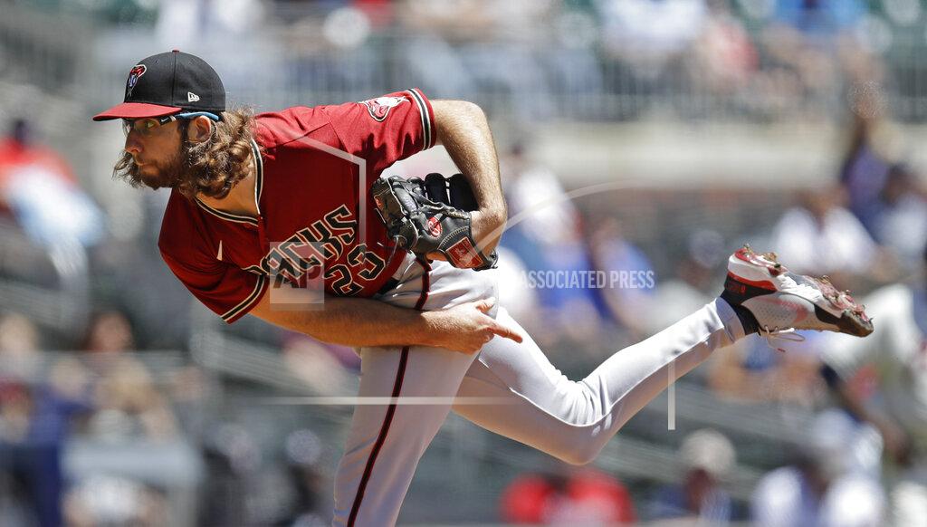 Ben Margot Arizona Diamondbacks pitcher Zac Gallen works against the Atlanta Braves in the first inning of the first baseball game of a double header, Sunday, April 25, 2021, in Atlanta. (AP Photo/Ben Margot)