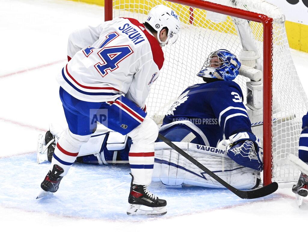 Frank Gunn Toronto Maple Leafs goaltender Jack Campbell (36) makes a save on Montreal Canadiens center Nick Suzuki (14) during the third period in Game 5 of an NHL hockey Stanley Cup first-round playoff series in Toronto on Thursday, May 27, 2021. (Frank Gunn/The Canadian Press via AP)