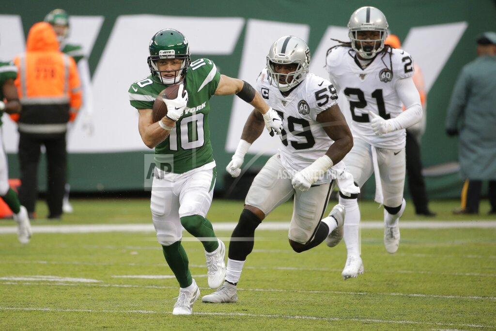Seth Wenig New York Jets wide receiver Braxton Berrios (10) runs away from Oakland Raiders' Tahir Whitehead (59) and D.J. Swearinger (21) during the second half of an NFL football game Sunday, Nov. 24, 2019, in East Rutherford, N.J. The Jets won 34-3. (AP Photo/Seth Wenig)