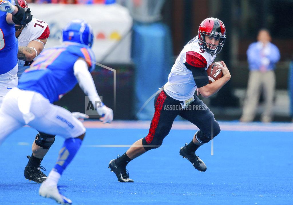 Steve Conner San Diego State quarterback Ryan Agnew (9) scrambles as away from the Boise State defense in the first half of an NCAA college football game, Saturday, Oct. 6, 2018, in Boise, Idaho. (AP Photo/Steve Conner)