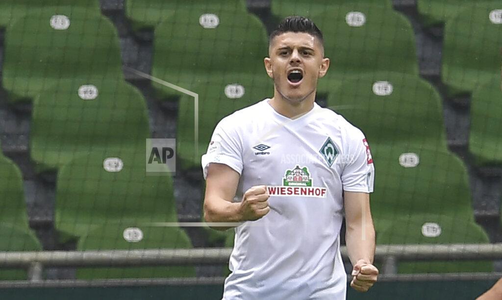Carmen Jaspersen Werder's Milot Rashica cheers for his goal to make it 2-0 during a German Bundesliga soccer match between Werder Bremen and 1. FC Cologne in Bremen, Germany, Saturday, June 27, 2020. (Carmen Jaspersen/dpa via AP, pool)