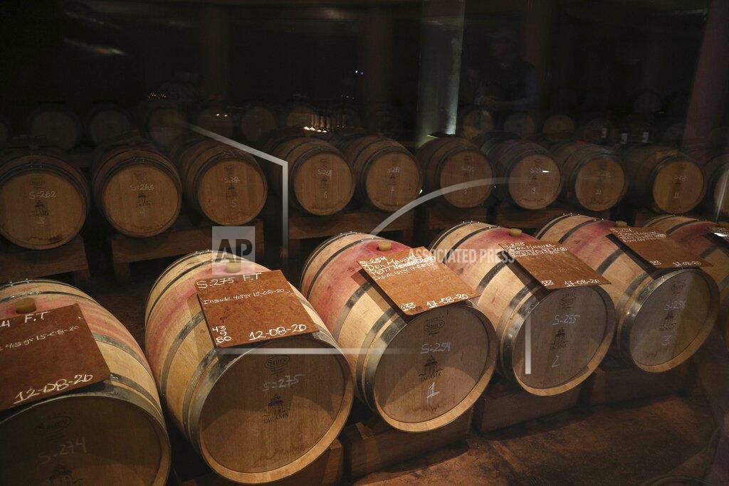 Martin Mejia Wine barrels sit at the Tacama vineyard in Ica, Peru, Monday, Sept. 28, 2020. More than 500 Pisco producers have seen their sales collapse by half and thousands of grape growers have had their fields ruined because of the late harvests, because of the strict lockdown implemented to stop COVID-19. (AP Photo/Martin Mejia)