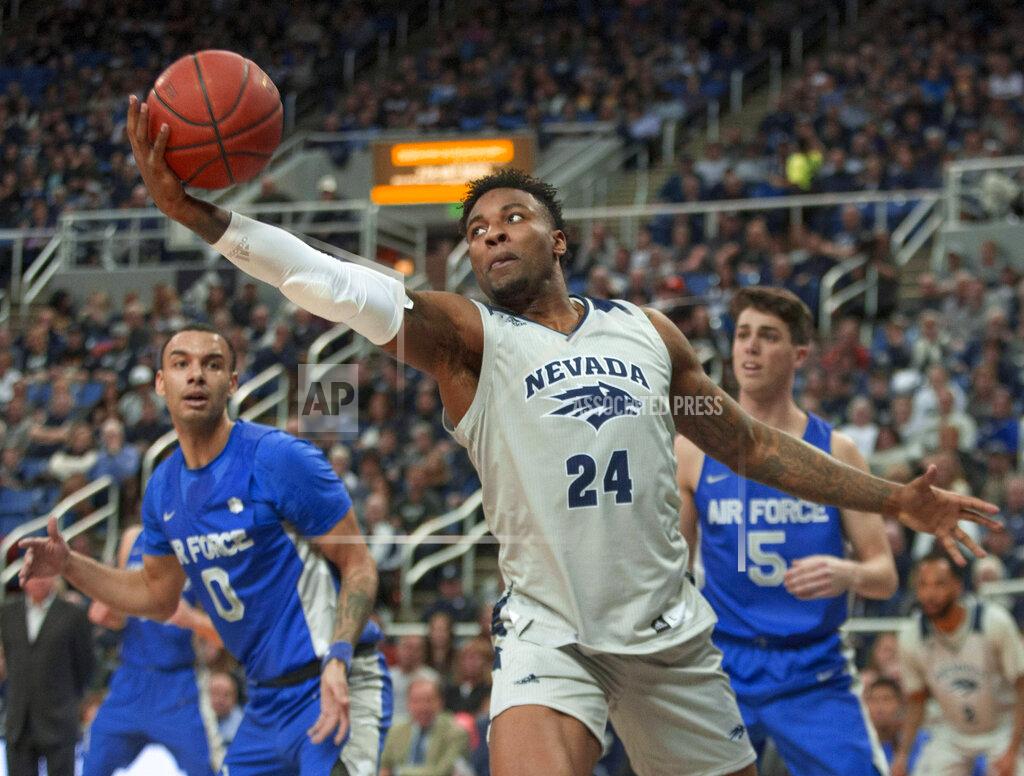 Tom R. Smedes Nevada forward Jordan Caroline (24) grabs a rebound against Air Force in the first half of an NCAA college basketball game in Reno, Nev., Saturday, Jan. 19, 2019. (AP Photo/Tom R. Smedes)
