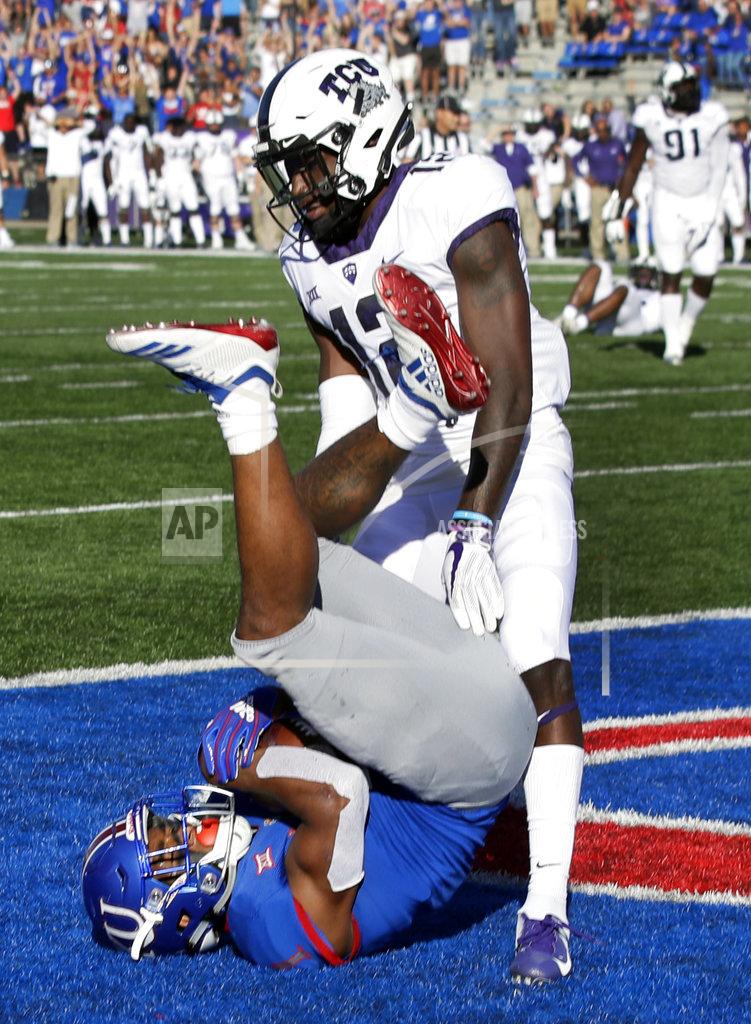 Orlin Wagner Kansas running back Pooka Williams Jr. (1) lands in the end zone for a touchdown while covered by TCU cornerback Jeff Gladney (12) during the second half of an NCAA college football game in Lawrence, Kan., Saturday, Oct. 27, 2018. (AP Photo/Orlin Wagner)