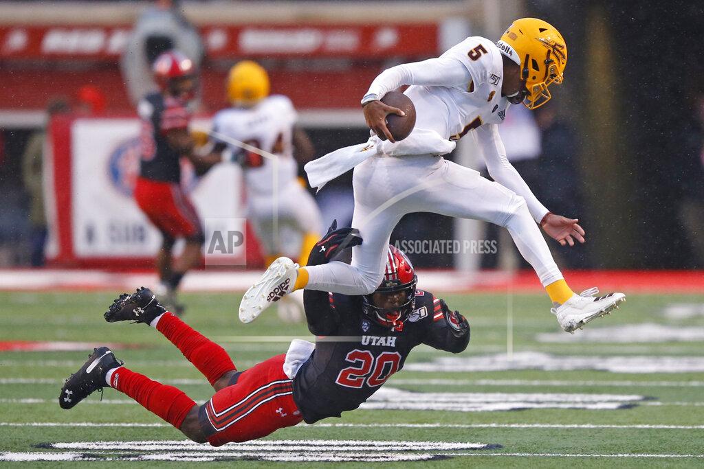 Rick Bowmer Utah linebacker Devin Lloyd (20) tackles Arizona State quarterback Jayden Daniels (5) during the first half of an NCAA college football game Saturday, Oct. 19, 2019, in Salt Lake City. (AP Photo/Rick Bowmer)