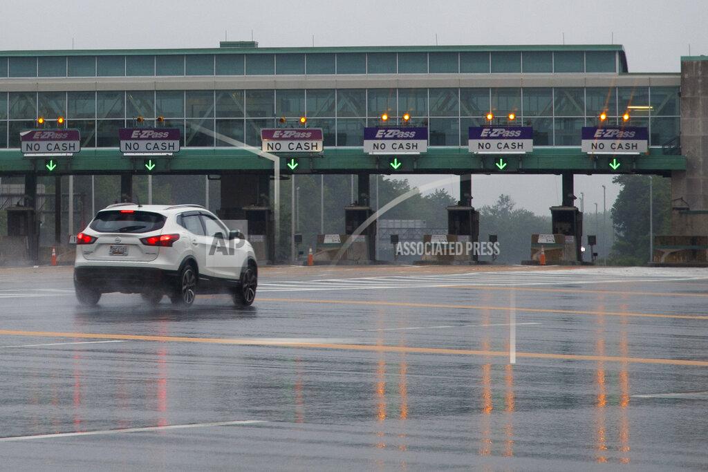 Matt Slocum A motorist passes through a New Jersey Turnpike toll plaza, Friday, July 31, 2020, in Carneys Point, N.J. (AP Photo/Matt Slocum)