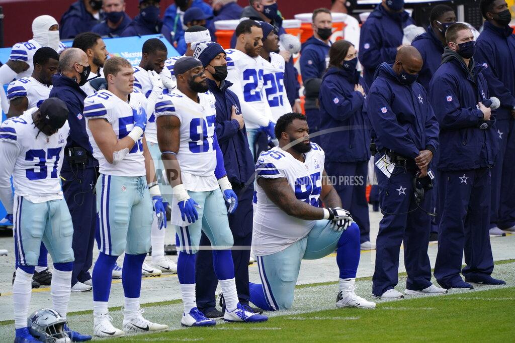Susan Walsh Members of the Dallas Cowboys on the sidelines during playing of the National Anthem before the start of an NFL football game against Washington Football Team, Sunday, Oct. 25, 2020, in Landover, Md. (AP Photo/Susan Walsh)