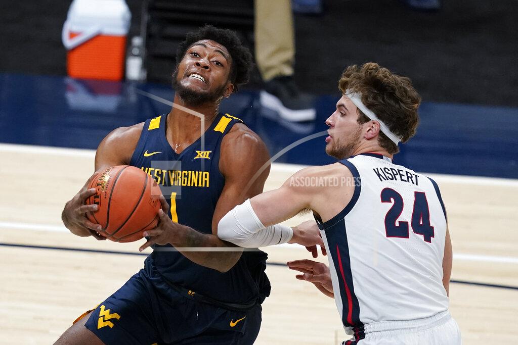 Darron Cummings West Virginia's Derek Culver (1) goes to the basket against Gonzaga's Corey Kispert (24) during the first half of an NCAA college basketball game Wednesday, Dec. 2, 2020, in Indianapolis. (AP Photo/Darron Cummings)