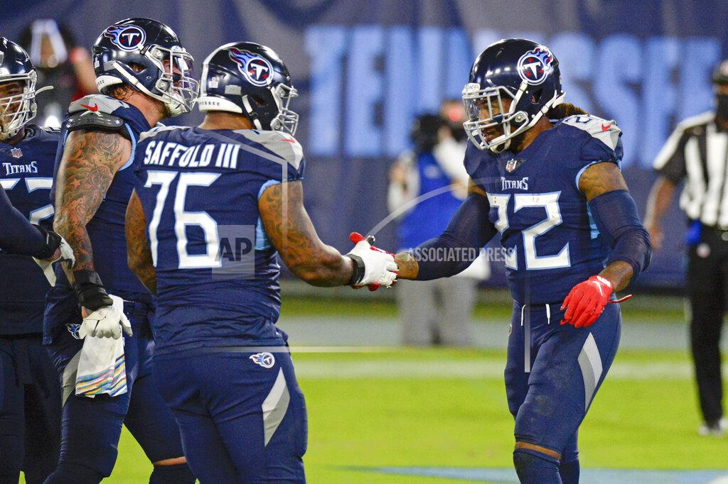 Mark Zaleski Tennessee Titans running back Derrick Henry (22) is congratulated by offensive guard Rodger Saffold (76) after scoring a touchdown against the Buffalo Bills in the first half of an NFL football game Tuesday, Oct. 13, 2020, in Nashville, Tenn. (AP Photo/Mark Zaleski)