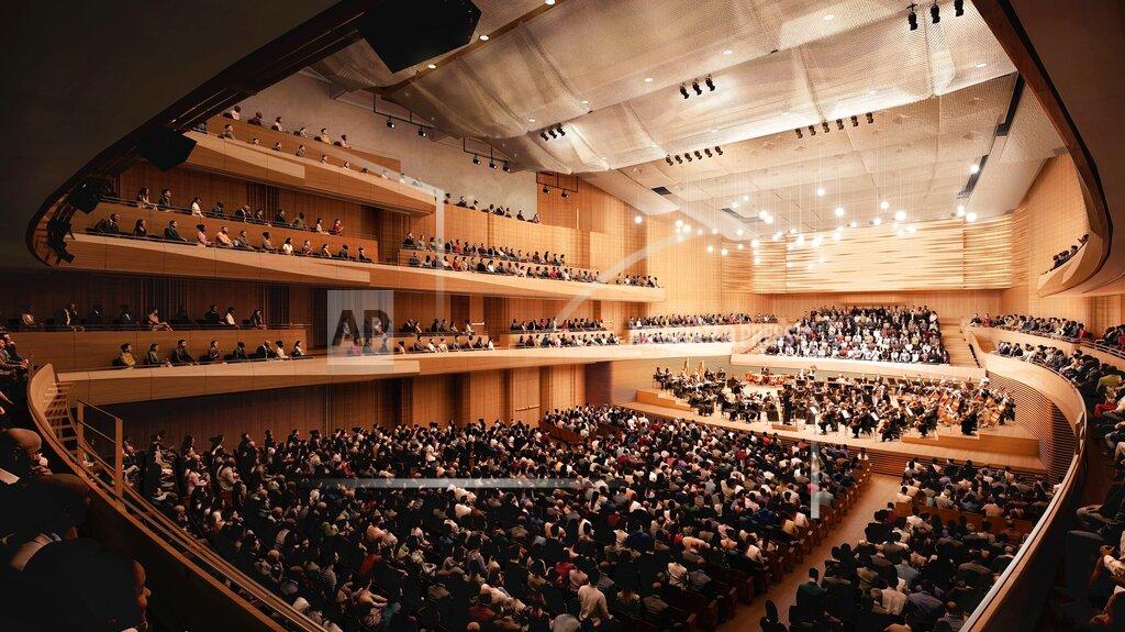 This artist rendering released by the New York Philharmonic shows the interior of David Geffen Hall in New York. The New York Philharmonic and Lincoln Center for the Performing Arts are accelerating the reconstruction of Geffen Hall because of the novel coronavirus pandemic and plan to reopen the auditorium in fall of 2022, about 1 1/2 years ahead of the original schedule. (Diamond Schmitt Architects/New York Philharmonic via AP)