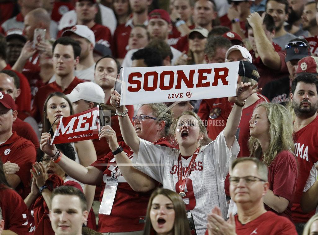 Lynne Sladky Oklahoma fans cheer their team, during the first half of the Orange Bowl NCAA college football game against Alabama, Saturday, Dec. 29, 2018, in Miami Gardens, Fla. (AP Photo/Lynne Sladky)