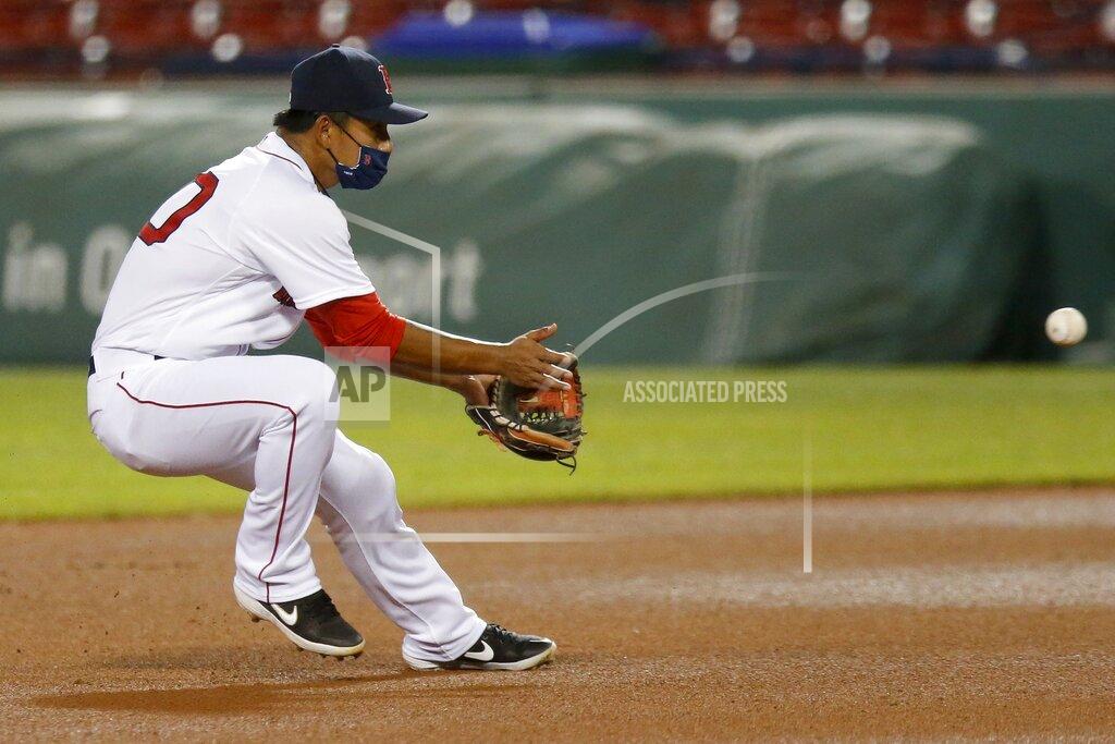 Michael Dwyer Boston Red Sox's Tzu-Wei Lin fields the ball while wearing a protective mask during the eighth inning of an opening day baseball game against the Baltimore Orioles at Fenway Park, Friday, July 24, 2020, in Boston. (AP Photo/Michael Dwyer)