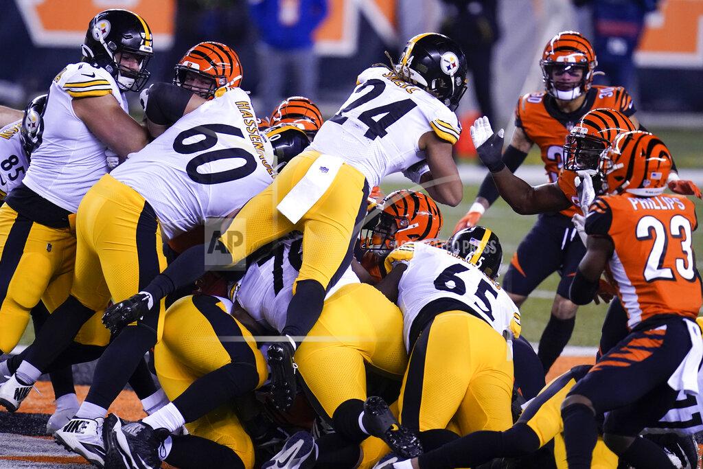 Michael Conroy Pittsburgh Steelers' Benny Snell (24) dives for a first down on a fourth-down play during the first half of an NFL football game against the Cincinnati Bengals, Monday, Dec. 21, 2020, in Cincinnati. (AP Photo/Michael Conroy)