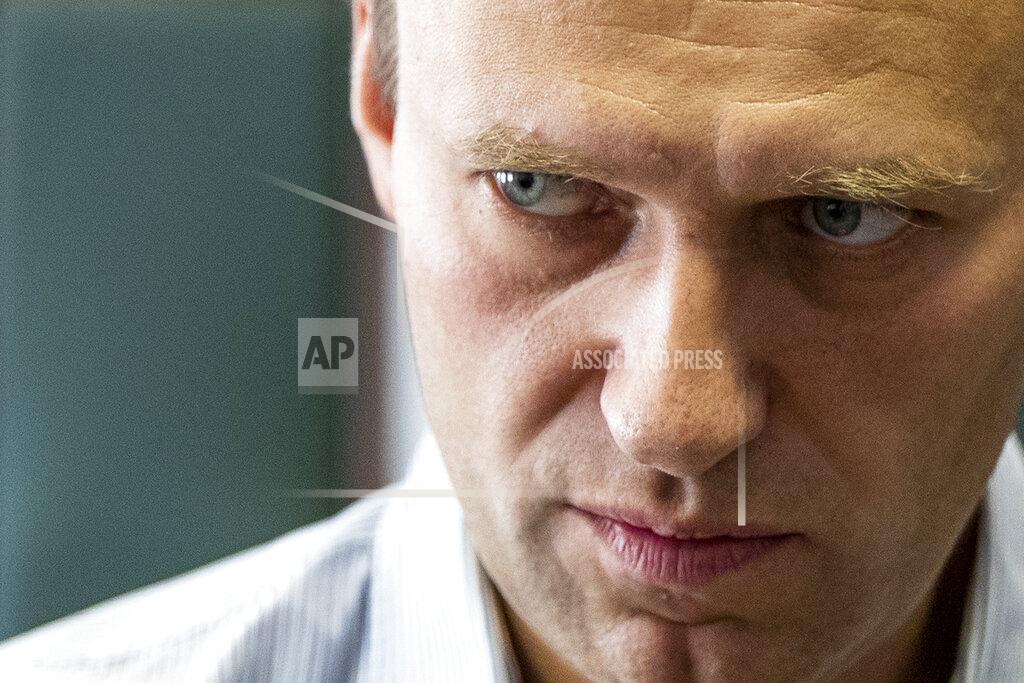 Pavel Golovkin FILE - In this Wednesday, Sept. 5, 2018 file photo Russian opposition leader Alexei Navalny stands during a break in the hearing on his appeal in a court in Moscow, Russia. Russian opposition politician Alexei Navalny was placed on a ventilator in a hospital intensive care unit in Siberia after falling ill from suspected poisoning during a flight, his spokeswoman said Thursday Aug. 20, 2020. (AP Photo/Pavel Golovkin, File)
