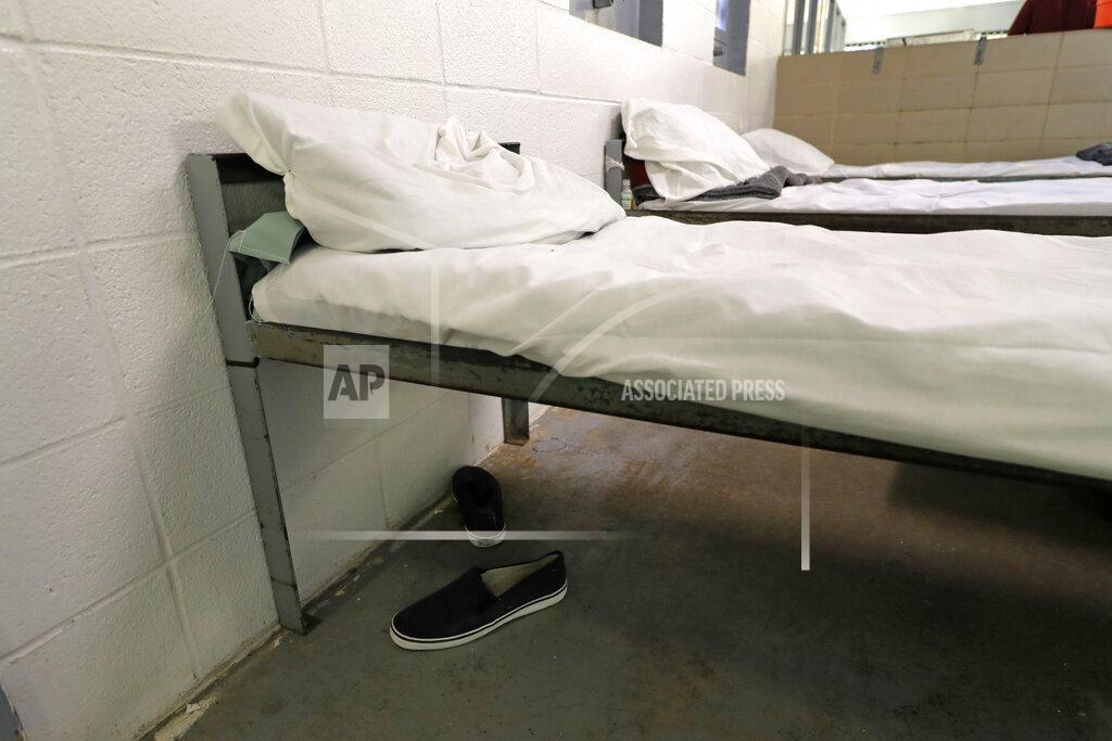 Gerald Herbert FILE — Shoes are seen under a bed during a media tour of the Winn Correctional Center in Winnfield, La., in this Thursday, Sept. 26, 2019 file photo. The number of detainees nationwide has more than doubled since the end of February 2021, to nearly 27,000, according to recent data from U.S. Immigration and Customs Enforcement. (AP Photo/Gerald Herbert, File)