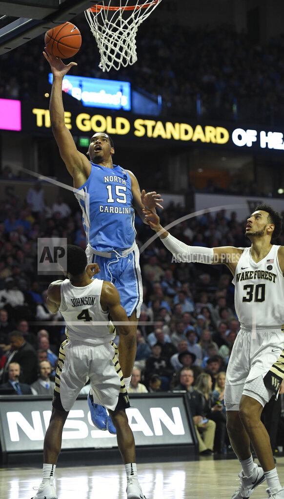 Woody Marshall North Carolina's Garrison Brooks (15) commits a charge against Wake Forest's Torry Johnson (4) during the second half of an NCAA college basketball game in Winston-Salem, N.C., Saturday, Feb 16, 2019. (AP Photo/Woody Marshall)