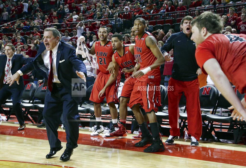 Nati Harnik FILE - In this Dec. 10, 2014, file photo, Incarnate Word coach Ken Burmeister, second left, and players on the bench celebrate after Incarnate Word's Kyle Hittle, right, hit the go-ahead basket for a 74-73 win over Nebraska in an NCAA college basketball game in Lincoln, Neb. Burmeister, a college basketball coach for 21 seasons who took Texas-San Antonio to the NCAA Tournament and later guided Loyola of Chicago, died Tuesday, May 19, 2020. He was 72. Loyola said Burmeister died following a bout with cancer. (AP Photo/Nati Harnik, File)