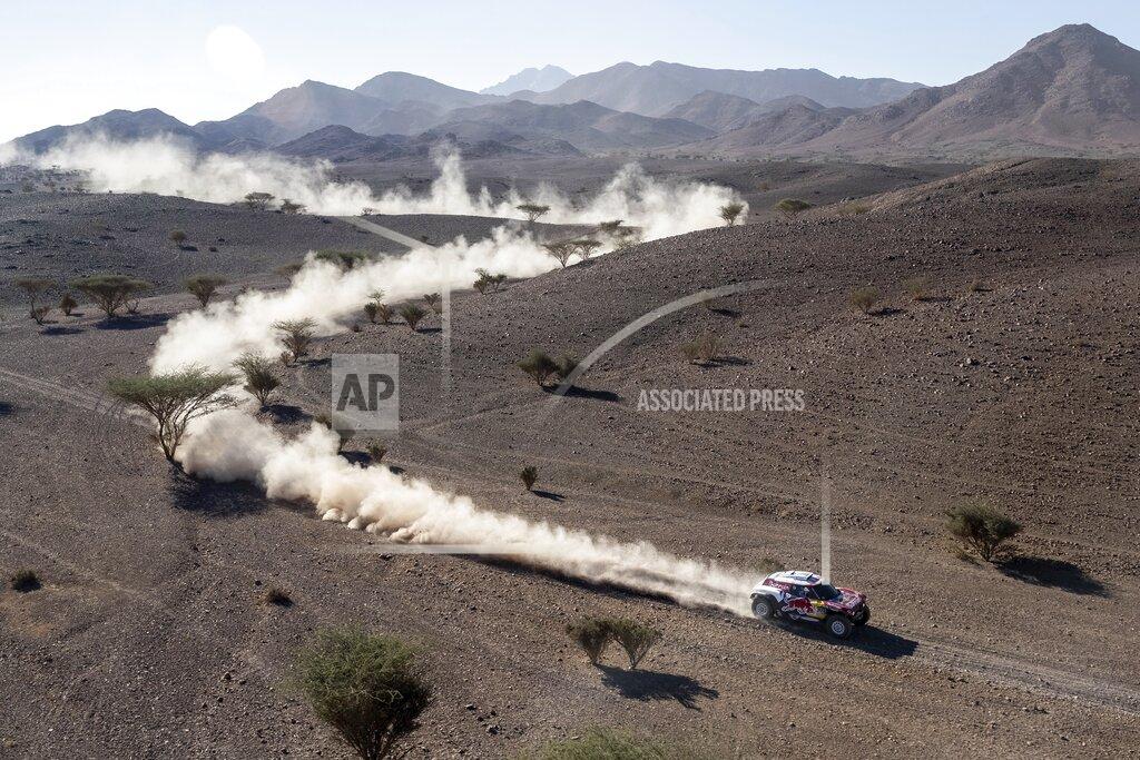 Bernat Armangue Driver Carlos Sainz, of Spain, and co-driver Lucas Cruz, of Spain, race their Mini during stage two of the Dakar Rally, between Al Wajh and Neom, Saudi Arabia, Monday, Jan. 6, 2020. (AP Photo/Bernat Armangue)