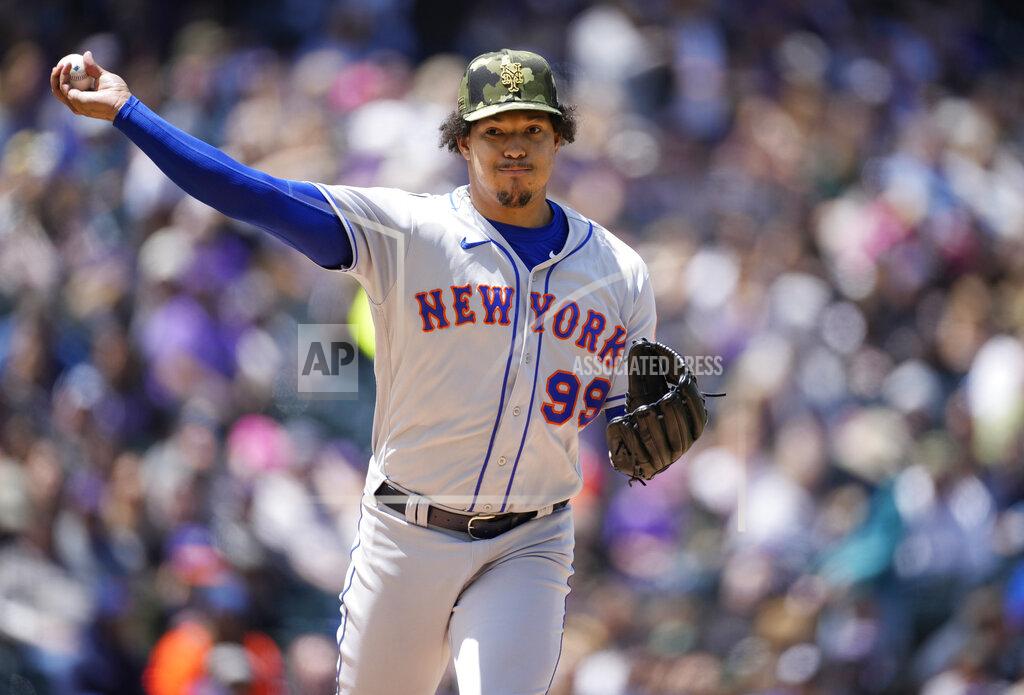 David Zalubowski New York Mets starting pitcher Taijuan Walker turns to make a pickoff-attempt against Colorado Rockies' Yonathan Daza in the first inning of a baseball game Sunday, May 22 2022, in Denver. (AP Photo/David Zalubowski)