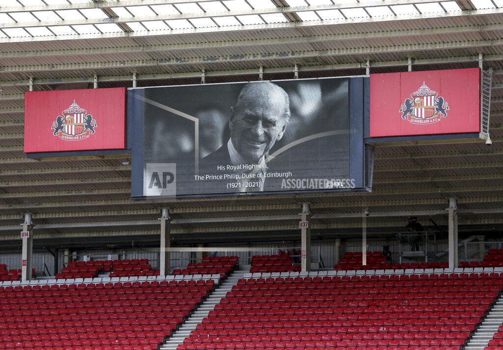 Richard Sellers Sunderland and Charlton Athletic players stand for a two minute silence following the death of Britain's Prince Philip, the Duke of Edinburgh yesterday, ahead of the League One soccer match at at the Stadium of Light, Sunderland, England, Saturday April 10, 2021. (Richard Sellers/PA via AP)