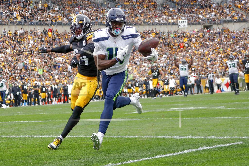 Don Wright Seattle Seahawks wide receiver D.K. Metcalf (14) makes a catch past Pittsburgh Steelers strong safety Terrell Edmunds (34) for a touchdown in the second half of an NFL football game Sunday, Sept. 15, 2019, in Pittsburgh. The play was reviewed and let stand as a touchdown. (AP Photo/Don Wright)