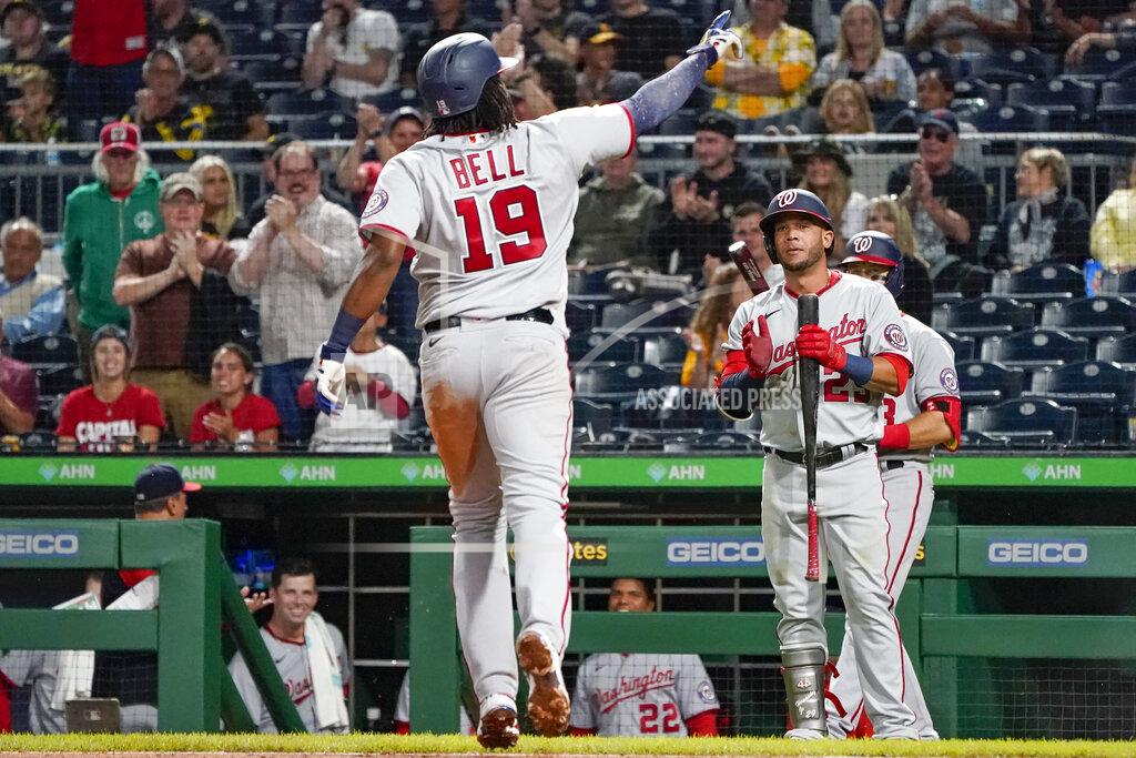 Keith Srakocic Washington Nationals' Josh Bell (19) celebrates as he approaches on-deck batter Yadiel Hernandez (29) after hitting a solo home run against the Pittsburgh Pirates during the sixth inning of a baseball game Friday, Sept. 10, 2021, in Pittsburgh. (AP Photo/Keith Srakocic)