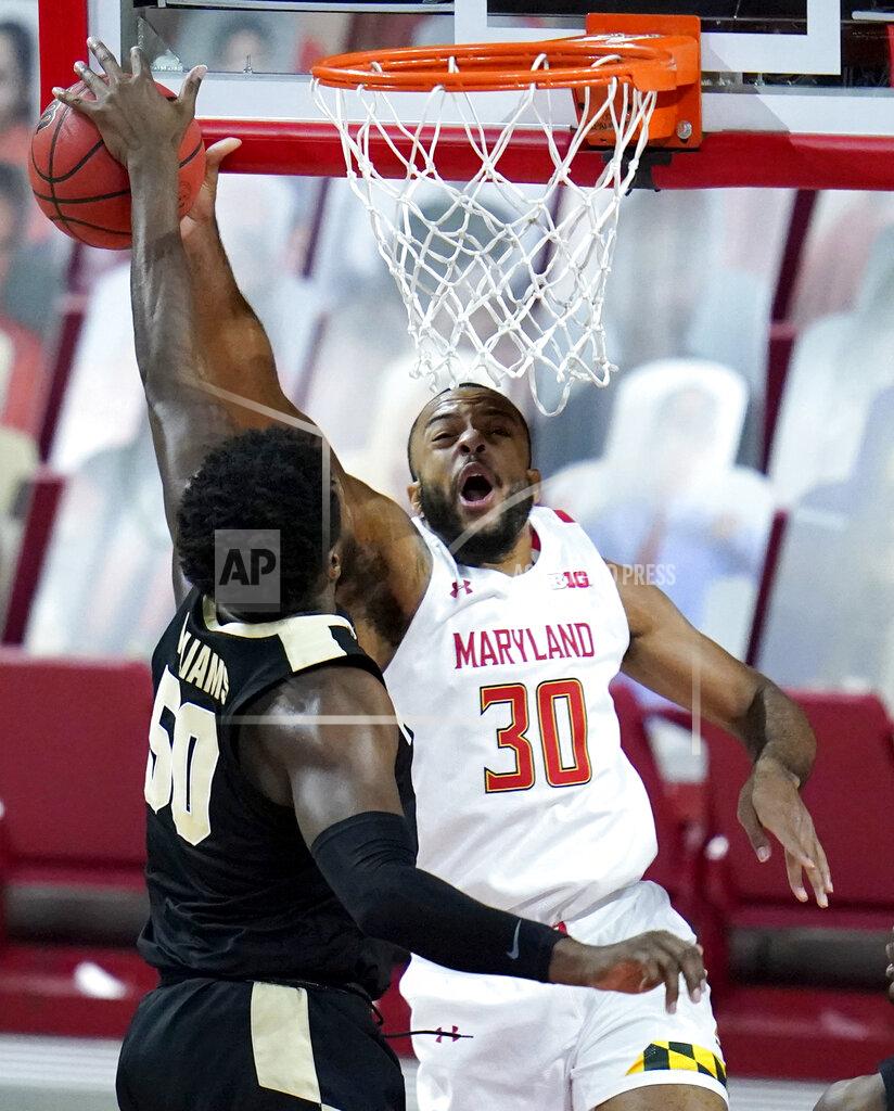 Julio Cortez Purdue forward Trevion Williams (50) blocks a shot by Maryland forward Galin Smith (30) during the first half of an NCAA college basketball game, Tuesday, Feb. 2, 2021, in College Park. (AP Photo/Julio Cortez)