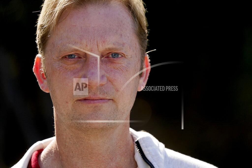 Gregory Bull Michael White stands for a portrait Wednesday, Jan. 13, 2021, in San Diego. The Navy veteran kept a handwritten document detailing the nearly two years he spent imprisoned in Iran. The Associated Press obtained a copy of the manuscript. In it, he catalogues physical abuse from his jailers and taunts from fellow inmates while held on dubious allegations. (AP Photo/Gregory Bull)