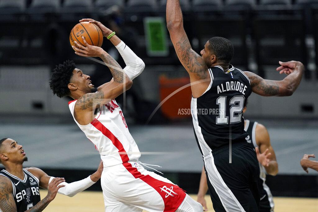 Eric Gay Houston Rockets center Christian Wood (35) shoots against San Antonio Spurs center LaMarcus Aldridge (12) during the second half of an NBA basketball game in San Antonio, Thursday, Jan. 14, 2021. (AP Photo/Eric Gay)