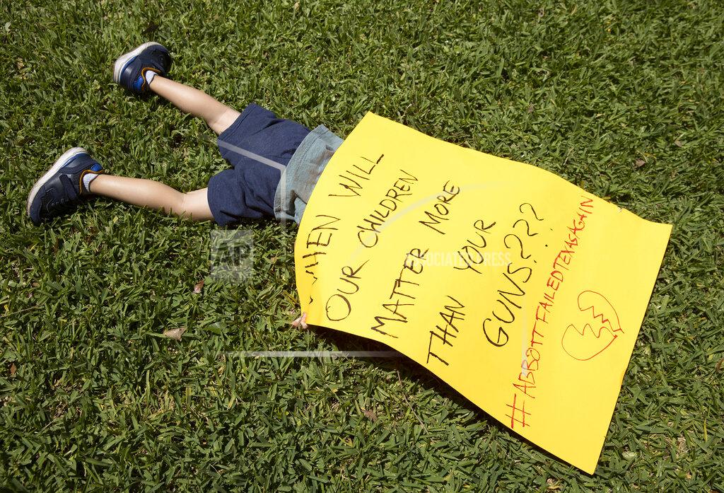 Jay Janner Remy Ragsdale, 3, attends a protest organized by Moms Demand Action on Wednesday May 25, 2022, at the Governor's Mansion in Austin, Texas, after a mass shooting at an elementary school in Uvalde. (Jay Janner/Austin American-Statesman via AP)