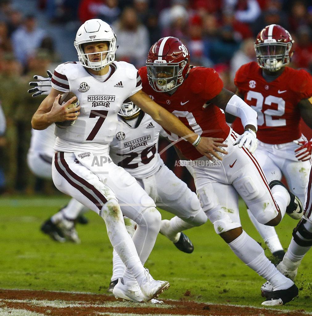 Butch Dill Mississippi State quarterback Nick Fitzgerald (7) tries to escape pressure from Alabama linebacker Mack Wilson (30) during the second half of an NCAA college football game, Saturday, Nov. 10, 2018, in Tuscaloosa, Ala. (AP Photo/Butch Dill)
