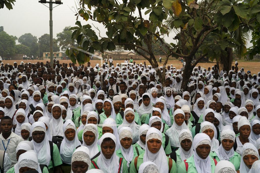 Leo Correa Students sing the national anthem before class at a secondary school in Koidu, district of Kono, Sierra Leone, Friday, Nov. 20, 2020. (AP Photo/Leo Correa)