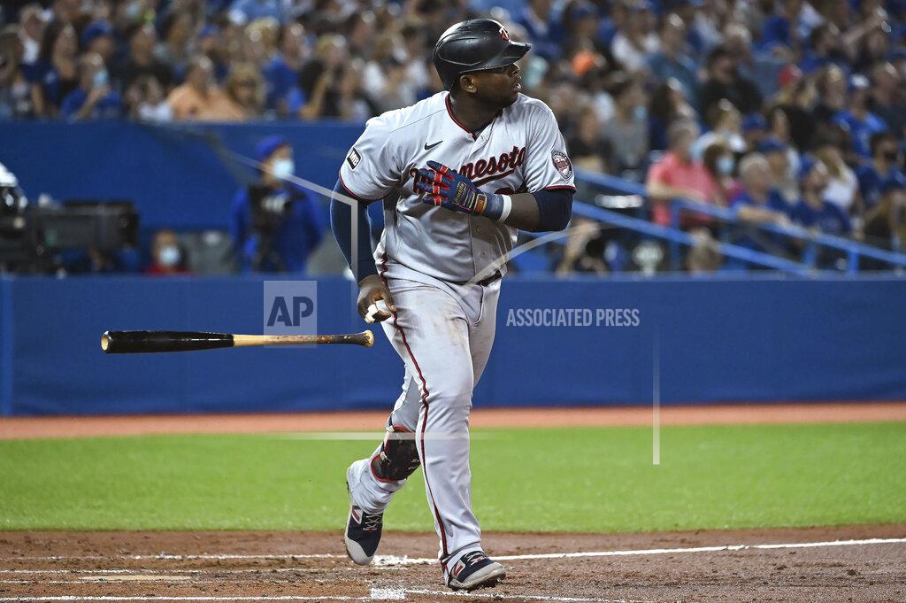 Jon Blacker Minnesota Twins' Miguel Sano watches his solo home run against the Toronto Blue Jays during the third inning of a baseball game Friday, Sept. 17, 2021, in Toronto. (Jon Blacker/The Canadian Press via AP)