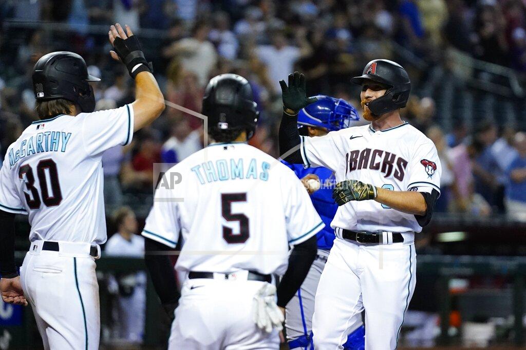 Ross D. Franklin Arizona Diamondbacks' Jordan Luplow, right, celebrates his three-run home run against the Kansas City Royals with Alek Thomas (5) and Jake McCarthy (30) during the sixth inning of a baseball game Tuesday, May 24, 2022, in Phoenix. (AP Photo/Ross D. Franklin)
