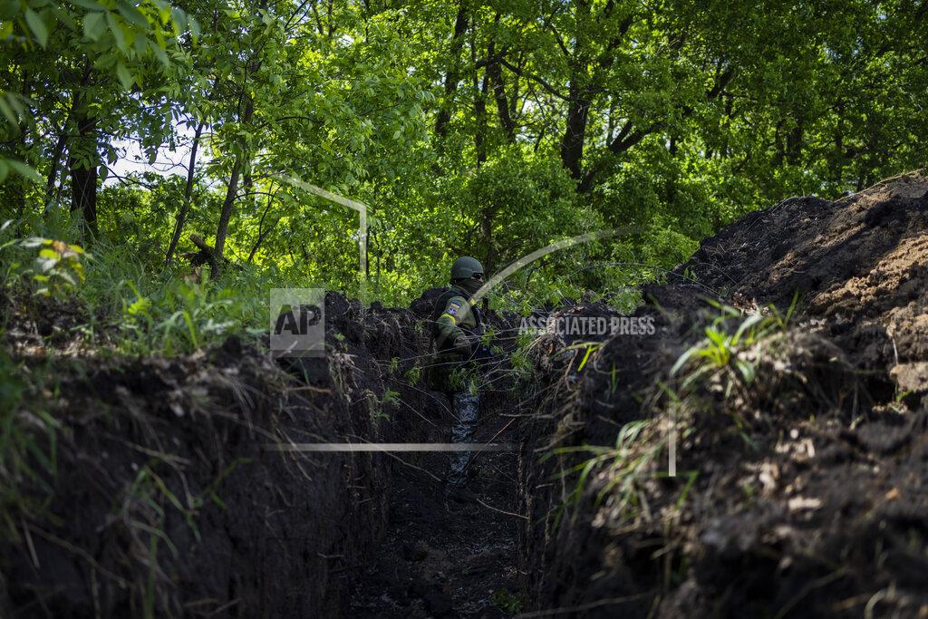 Bernat Armangue A Ukrainian serviceman stands in a trench in Kharkiv region, eastern Ukraine, Monday, May 23, 2022. (AP Photo/Bernat Armangue)