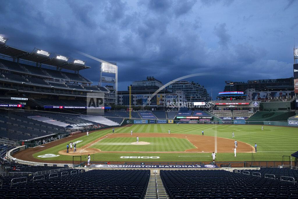 Alex Brandon Clouds move in during the fourth inning of an opening day baseball game between the Washington Nationals and the New York Yankees at Nationals Park, Thursday, July 23, 2020, in Washington. (AP Photo/Alex Brandon)
