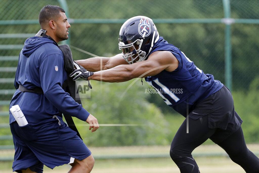 Mark Humphrey Tennessee Titans outside linebacker Cameron Wake, right, runs a drill during an organized team activity at the Titans' NFL football training facility Tuesday, June 4, 2019, in Nashville, Tenn. Fans have been wanting to know how Tennessee will get more sacks after the retirement of Brian Orakpo and the free agent signing of 37-year-old Cameron Wake. (AP Photo/Mark Humphrey)