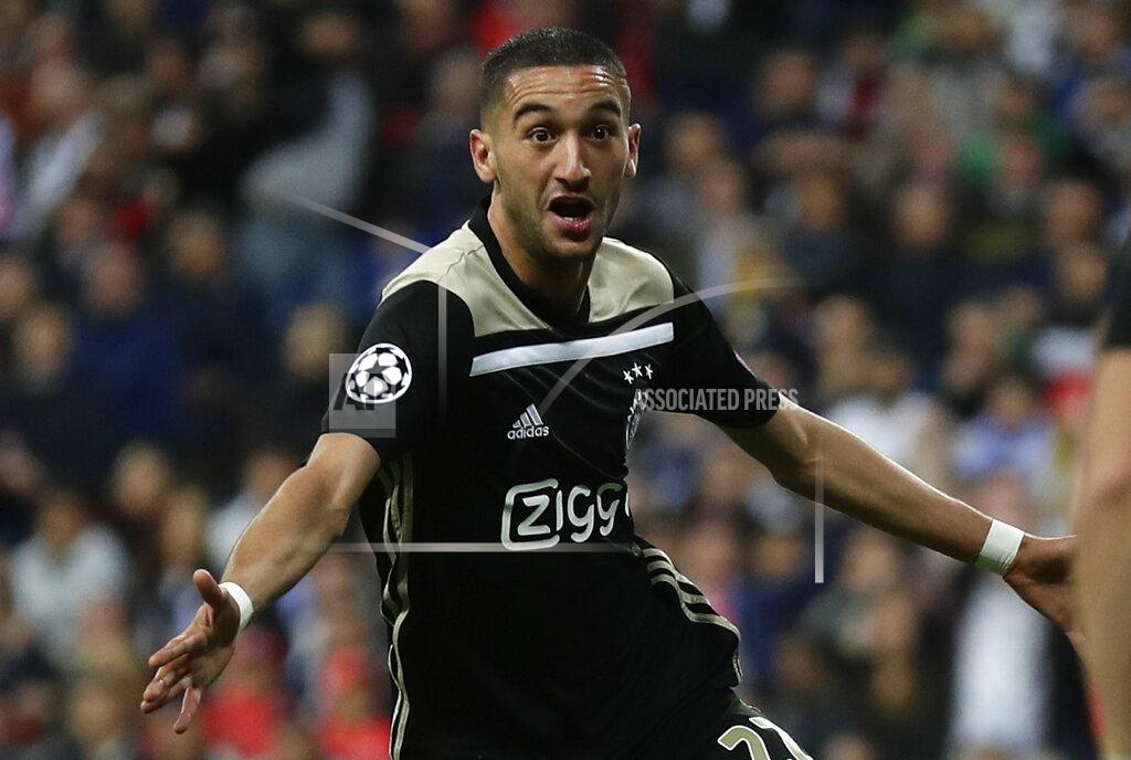 Manu Fernandez FILE - In this Tuesday, March 5, 2019 file photo, Ajax's Hakim Ziyech celebrates scoring the opening goal during their Champions League soccer match against Real Madrid at the Santiago Bernabeu stadium in Madrid, Spain. Chelsea agreed to sign winger Hakim Ziyech from Ajax at the end of the season on Thursday, Feb. 13, 2020 for 40 million euros ($43 million). Ajax said the Morocco winger will join Chelsea on July 1 after finishing the season. (AP Photo/Manu Fernandez, file)