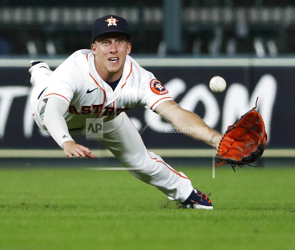 Kevin M. Cox Houston Astros center fielder Myles Straw dives for but misses a ball hit by Texas Rangers' Isiah Kiner-Falefa, who broke up a no-hitter in the eighth inning of a baseball game Saturday, July 24, 2021, in Houston. (Kevin M. Cox/The Galveston County Daily News via AP)