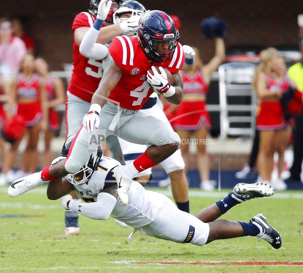 Rogelio V. Solis Mississippi running back Tylan Knight (4) hurdles Kent State cornerback Jamal Parker (7) for a first down during the first half of the NCAA college football game in Oxford, Miss., Saturday, Sept. 22, 2018. (AP Photo/Rogelio V. Solis)