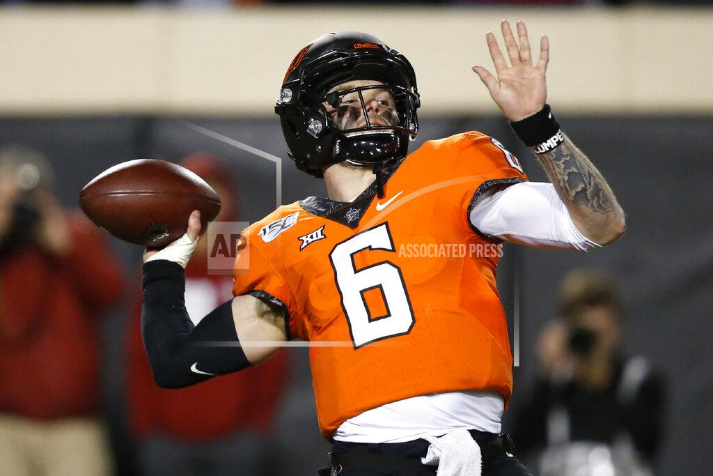 Sue Ogrocki Oklahoma State quarterback Dru Brown (6) throws in the second half of an NCAA college football game against Oklahoma in Stillwater, Okla., Saturday, Nov. 30, 2019. (AP Photo/Sue Ogrocki)