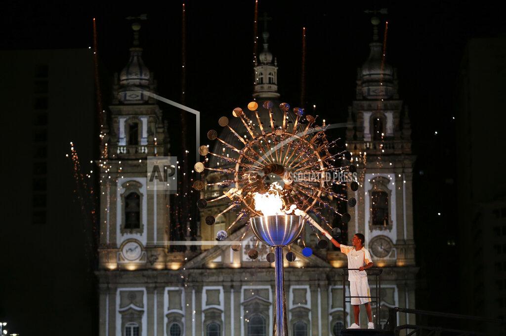 Natacha Pisarenko Jorge Alberto Oliveira Gomes lights the Olympic cauldron during the opening ceremony of the 2016 Summer Olympics in Rio de Janeiro, Brazil, Saturday, Aug. 6, 2016. (AP Photo/Natacha Pisarenko)