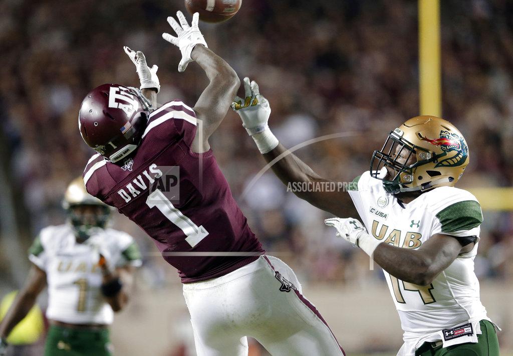 Michael Wyke Texas A&M wide receiver Quartney Davis (1) goes up for the reception in front of UAB cornerback Dy'jonn Turner (14) during the first half of an NCAA college football game Saturday, Nov. 17, 2018, in College Station, Texas. (AP Photo/Michael Wyke)