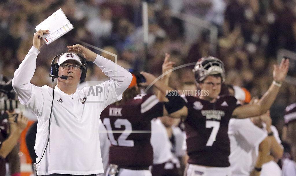 Jim Lytle Mississippi State head coach Joe Moorhead, left and quarterback Nick Fitzgerald (7) both react to the replay on the video board while game officials reviewed the play making sure Fitzgerald had indeed crossed the goal line and scored a touchdown during the first half of their NCAA college football game against Auburn on Saturday, Oct. 6, 2018, in Starkville, Miss. (AP Photo/Jim Lyle)