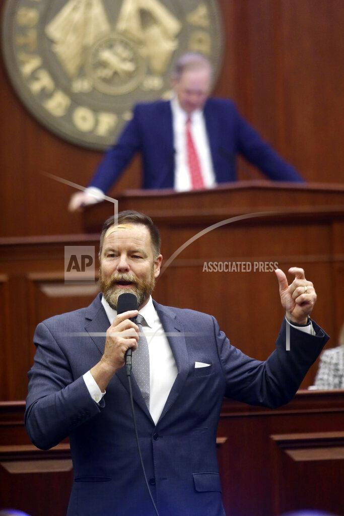 Phil Sears State Sen. Aaron Bean, R-Fernandina Beach makes a joke about state Sen. Gary Farmer's hair as the outgoing senator from Lighthouse Point is recognized prior to debate on Senate Bill CS/SB 2-D: Property Insurance in the Florida Senate, Tuesday, May 24, 2022, at the Capitol in Tallahassee, Fla. (AP Photo/Phil Sears)
