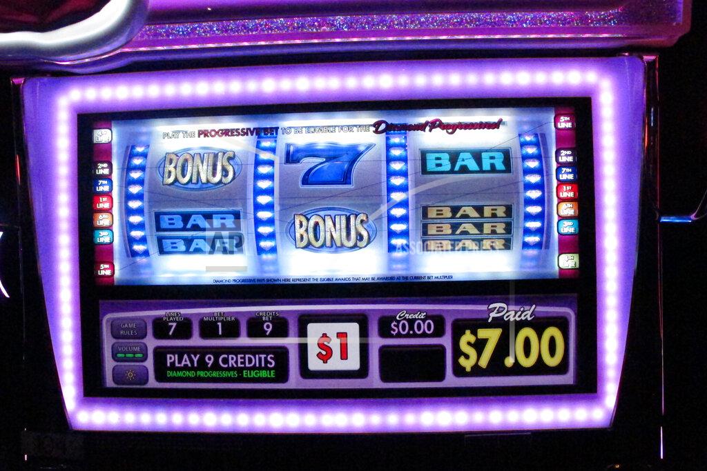 Wayne Parry This Oct. 8, 2019 photo, shows the screen of a slot machine at Resorts Casino in Atlantic City, N.J. How frequently slot machine surfaces should be wiped down, and how far apart players should have to be from each other are among the issues casinos are grappling with as they prepare to reopen after being shut down due to the coronavirus outbreak. (AP Photo/Wayne Parry)