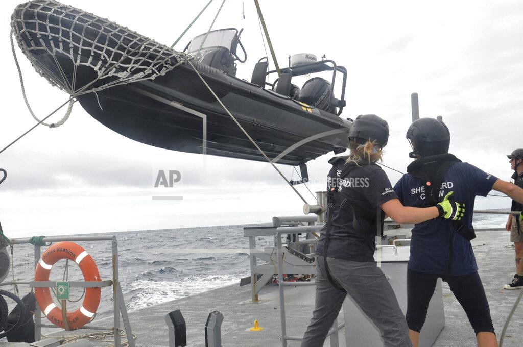 Joshua Goodman Members of Sea Shepherd, an ocean conservation group, lower an inflatable dinghy from the deck of the Ocean Warrior off the west coast of South America on July 17, 2021. Activists are seeking restrictions on fishing as part of negotiations underway on a first-ever High Seas Treaty, which could dramatically boost international cooperation on the traditionally lawless waters that comprise nearly half of the planet. (AP Photo/Joshua Goodman)