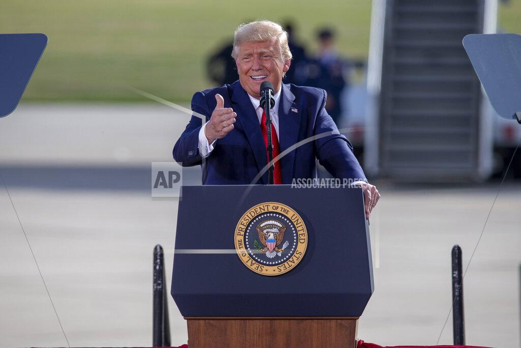 President Donald Trump speaks at an event at the Wittman Regional Airport Monday, Aug. 17, 2020, in Oshkosh, Wis. (AP Photo/Mike Roemer)