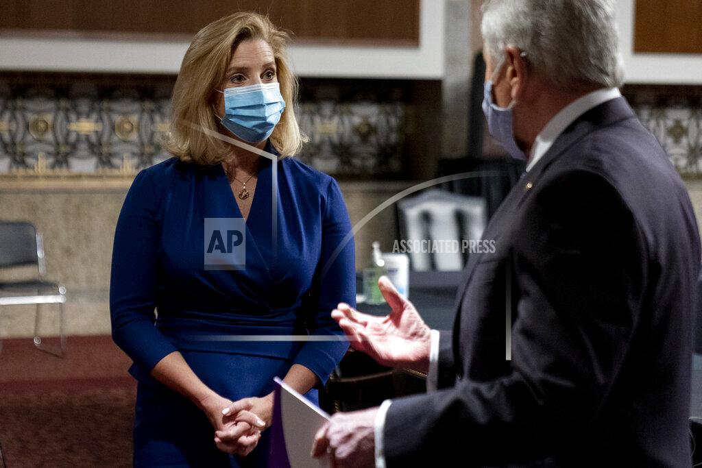 Andrew Harnik Nominee to be Secretary of the Army Christine Elizabeth Wormuth speaks with former Secretary of Defense Chuck Hagel, right, before a Senate Armed Services Committee nomination hearing on Capitol Hill in Washington, Thursday, May 13, 2021. (AP Photo/Andrew Harnik)